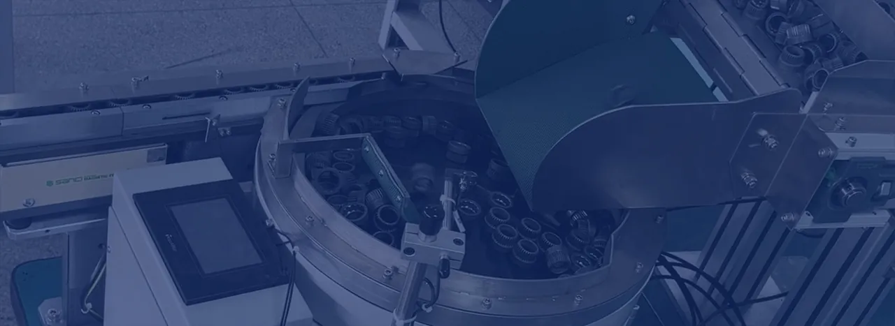 High-output industrial parts feeder with controls and discharge track